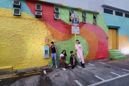 post-it-Artist-Trio-and-assistant-against-the-full-mural-wall