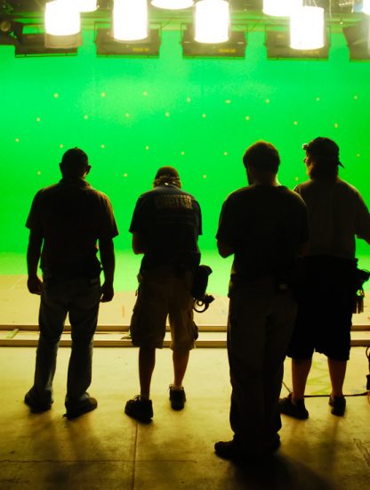 silhouette-camera-equipment-lights-dolly-stage-crew-green-screen-movie-making