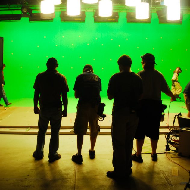 silhouette-camera-equipment-lights-dolly-stage-crew-green-screen-movie-making