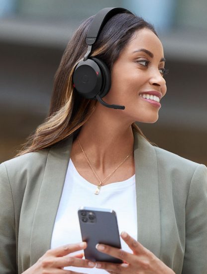 Jabra-Evolve2-75-Lifestyle-Female-Street-Walking-Phone-Medium