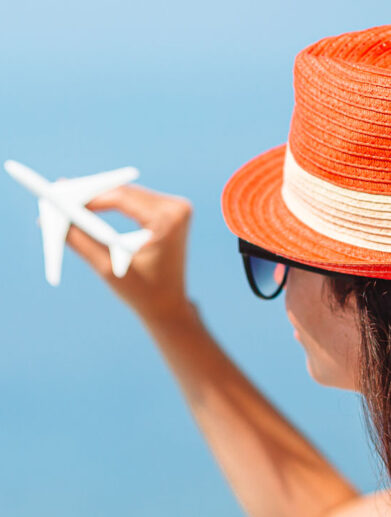 miniature-toy-airplane-in-female-hands-trip-by-ai-2021-08-29-16-48-26-utc